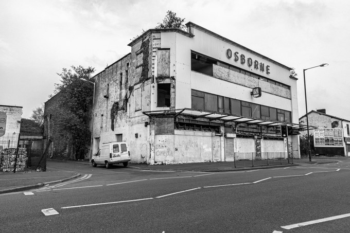 The New Osborne from the west corner, a white van parked against the rendered return wall.