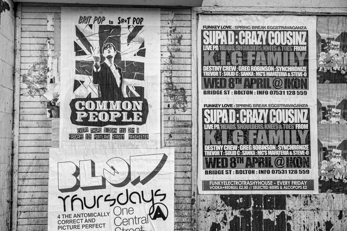 Fly-posters for club nights pasted over the boarded frontage of the New Osborne.